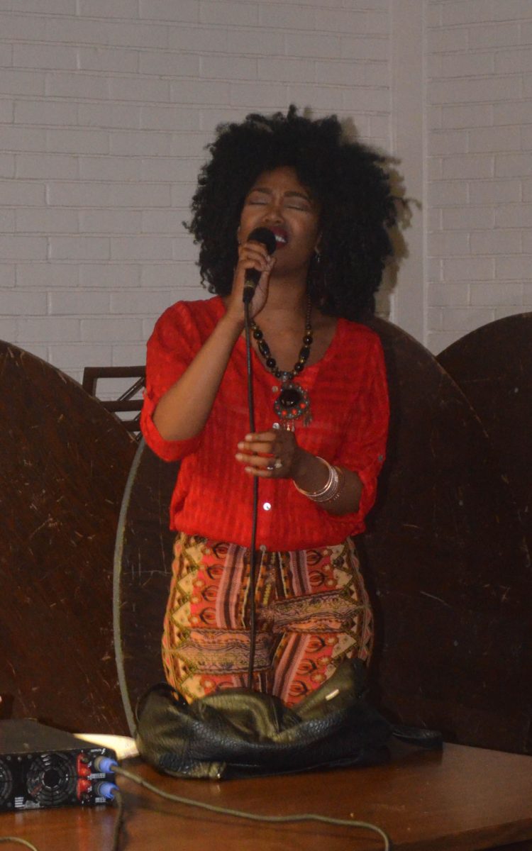 Junior, English major CheVon Allen singing "Summertime" at the AKA's Harlem Night Casino and Lounge held in the Student Union Gameroom.