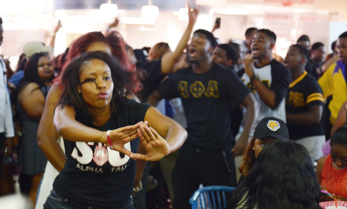 Jasmine Price, member of the Alpha Tau chapter of Delta Sigma Theta, leads her sorority sisters in a stroll during the first Pretty Wednesday of the Fall 2015 semester.