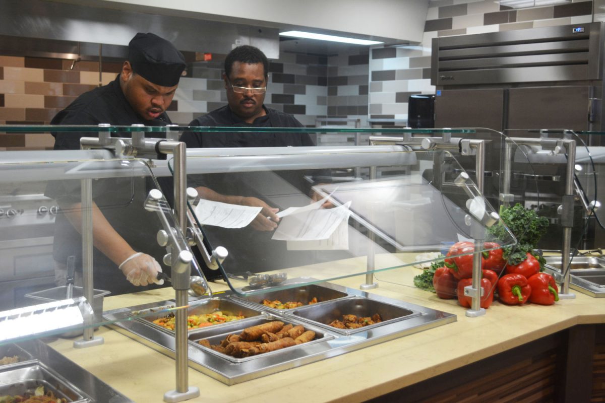 Smith-Brown Memorial Student Union chefs perform the last food inspections before the private food sampling event held Friday, August 21, in the New Union Food Courtyard.