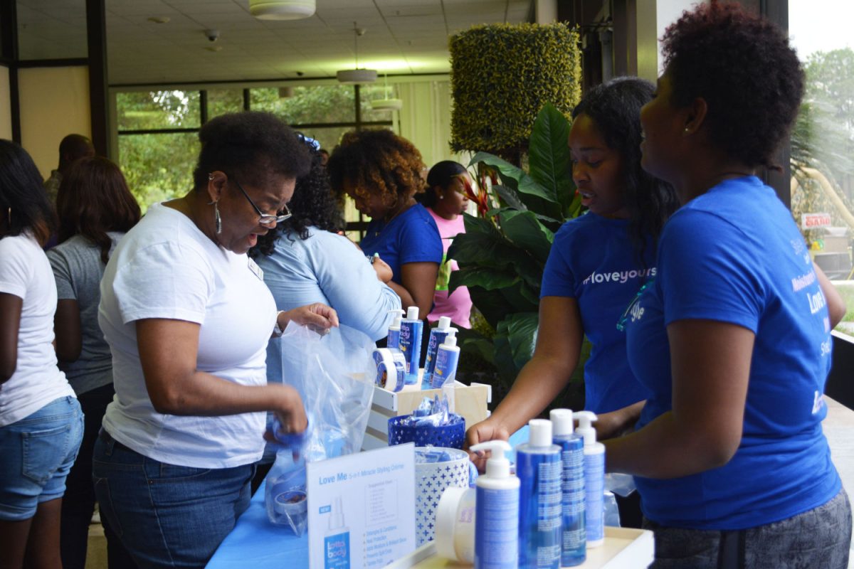 Lotta Body Student Beauty Ambassadors pass out samples of Lottabody hair care products inthe Smith-Brown Memorial Student Union.