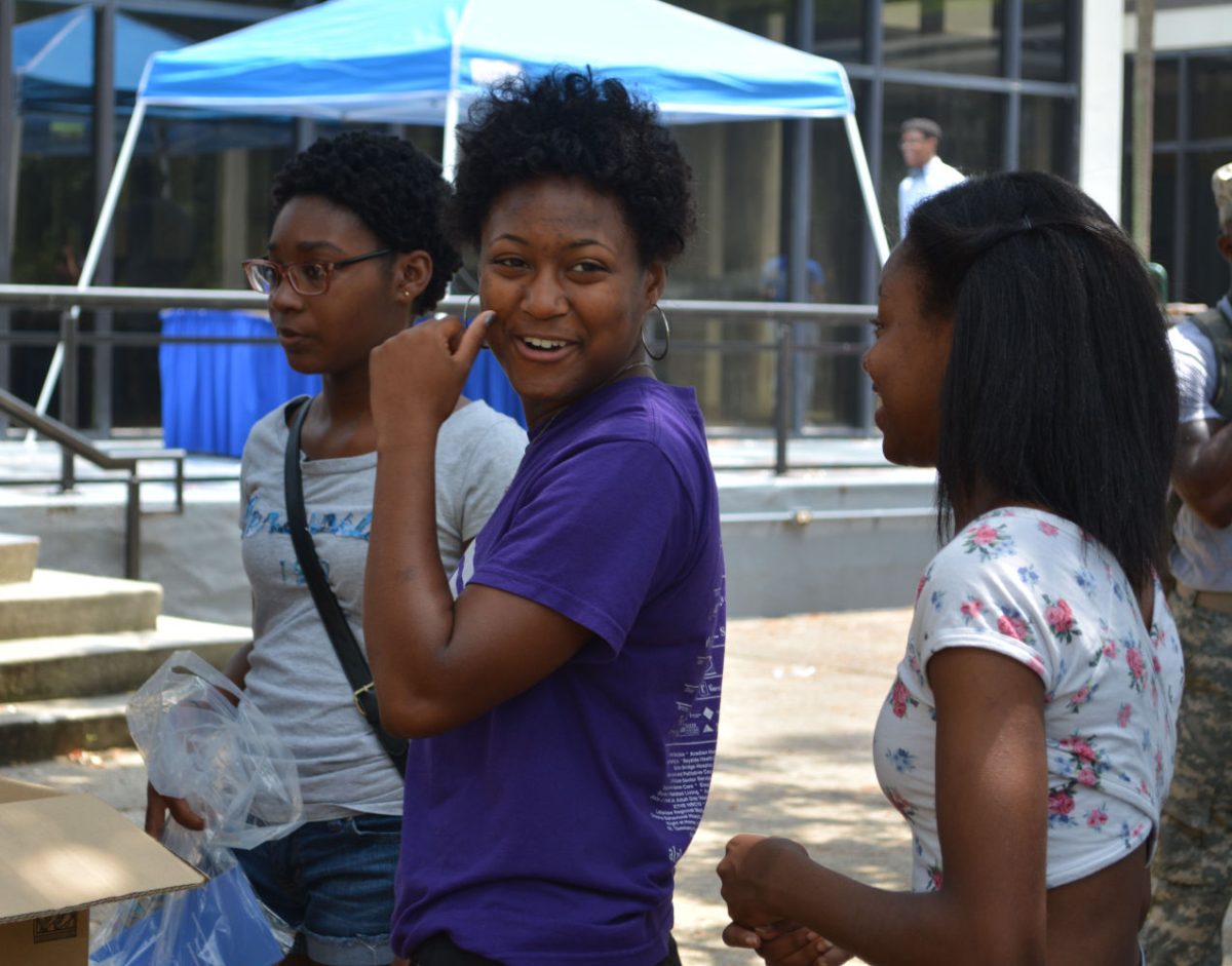 Kaysha Etiene, Southern University Junior/Student Athlete, shares a laugh with a friend during the Welcome Back Block Party held at the Student Union.