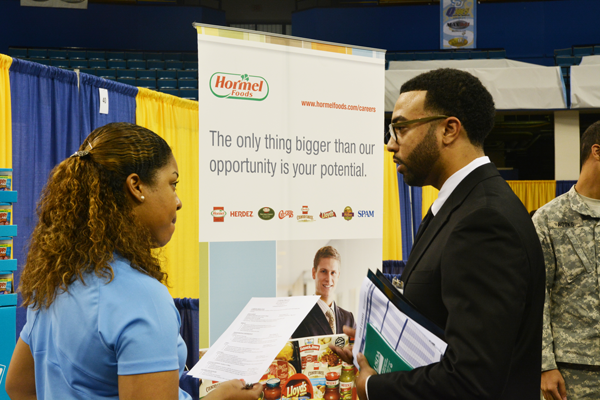 Calvin Moore, a junior accounting major from Baton Rouge, discusses his resume with a member of the Hormel Foods team during the 2016 Spring Career Fair held in F.G. Clark Activity Center on February 17