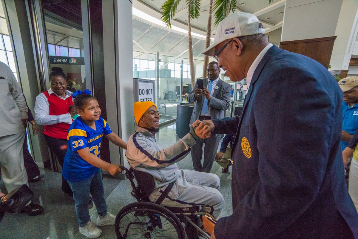 &#160;President-Chancellor Dr. Ray L. Belton greets Devon Gales as he&#160; arrives at the Baton Rouge Regional Airport on Saturday, March 5. Gales returned home for the first time after nearly six months of rehabilitation in Atlanta, GA.