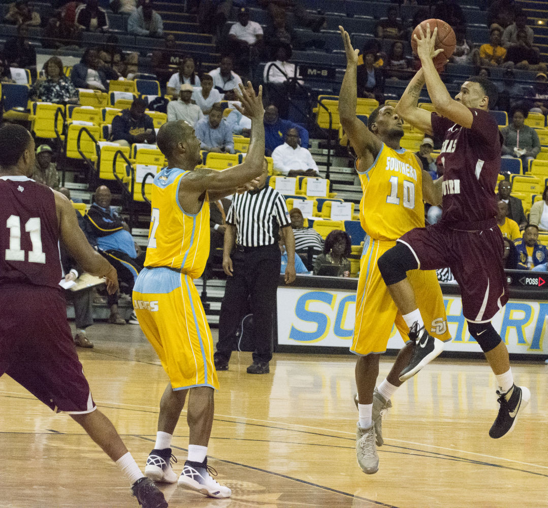 Jr. Shawn Prudhomme blocks a shot attempt from Texas Southern during Thursdays game at F.G Clark Activity Center.