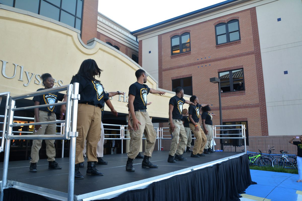 Resident assistants performing in the batle of the dorms step show on April 3rd, in front of Jones hall.