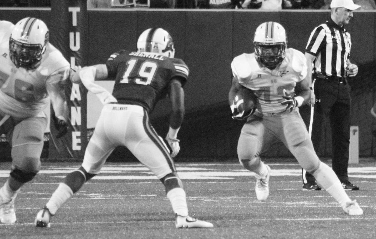 Kayla Foster/DIGEST
&#160;Junior running back Hebert Edwards avoids a Greenwave defender&#160; during the Jaguars matchup against Tulane on Saturday, September 10, at Yulman Stadium.
&#160;