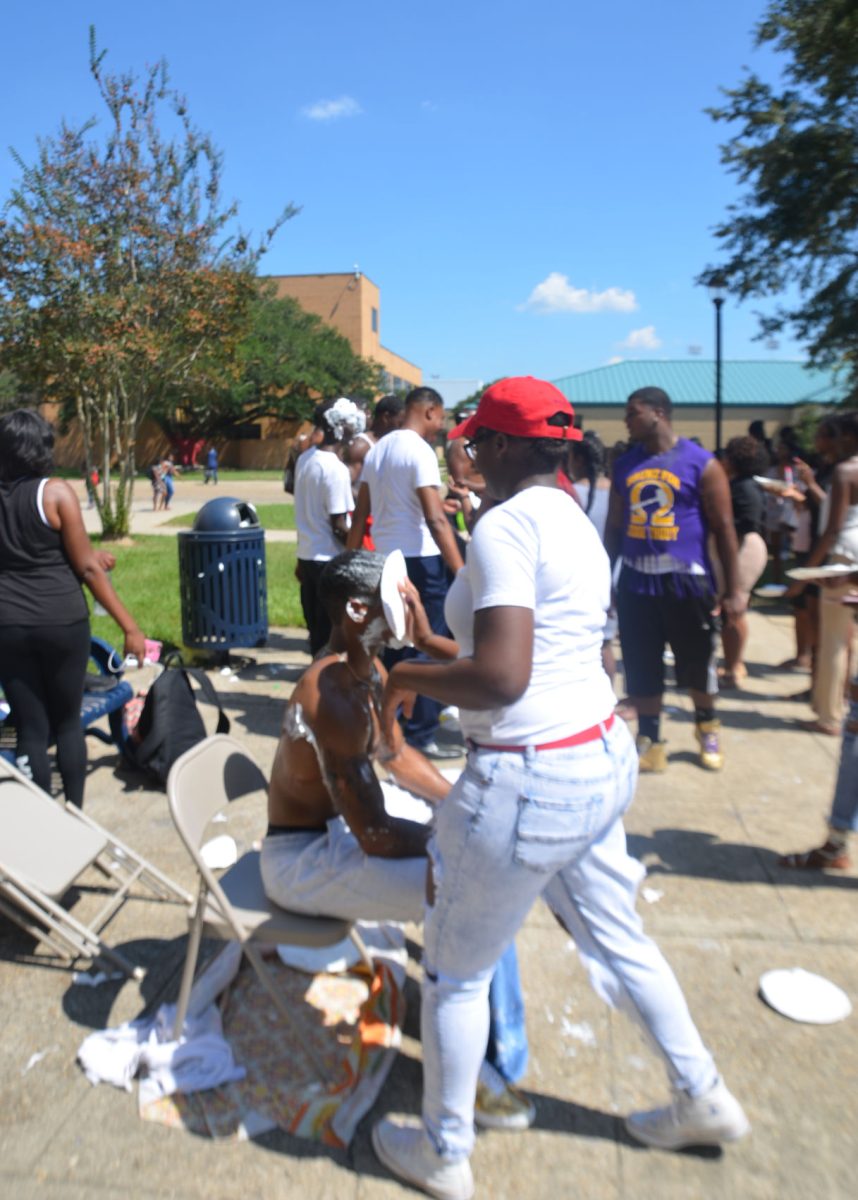 Members of Omega Psi Phi get pied in the face at pretty wednesday on September 21st 2016