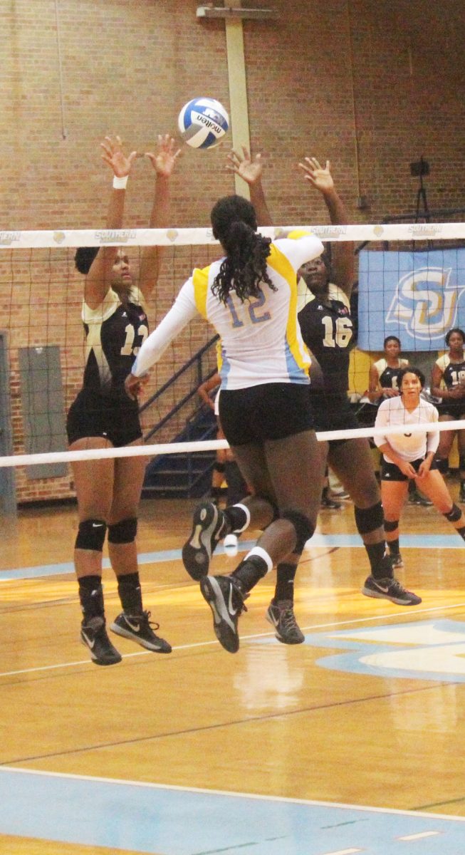 Freshman outside hitter Shelby Jolly spikes the ball over the net against the Alabama State Hornets on Sunday, September 18th.