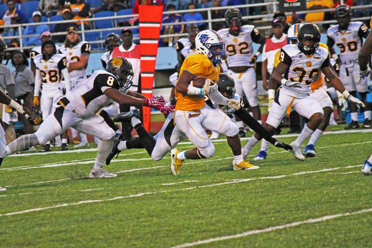 Senior running back Lenard Tillery evades UAPB defenders and rushes forward marker to the first down marker during the game on October 22 in A.W. Mumford Stadium.
&#160;Tillery finished with 135 yards and 2 Touchhdowns.