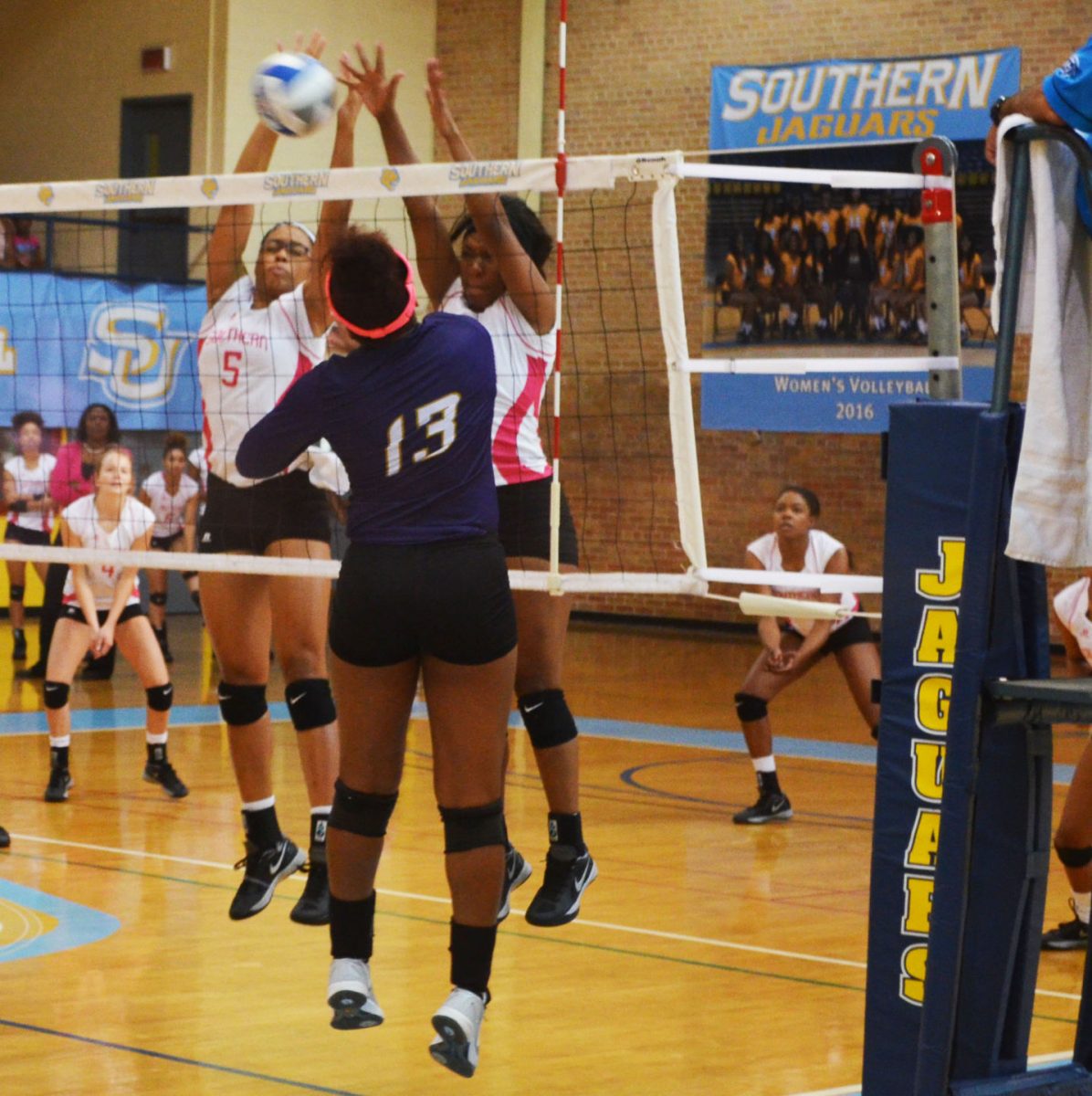 Freshman middle blocker Arabella Hall and freshman outside hitter Shelby Jolly block a spike against Alcorn State Braves on October 21 in Seymour Gym