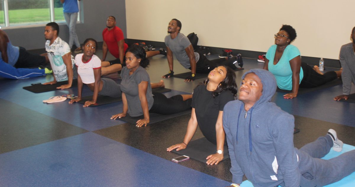 Student perform The "upward dog" Yoge move during Yoga Night held in the Horace W. Moody Intramural Sports Complex on October 3.