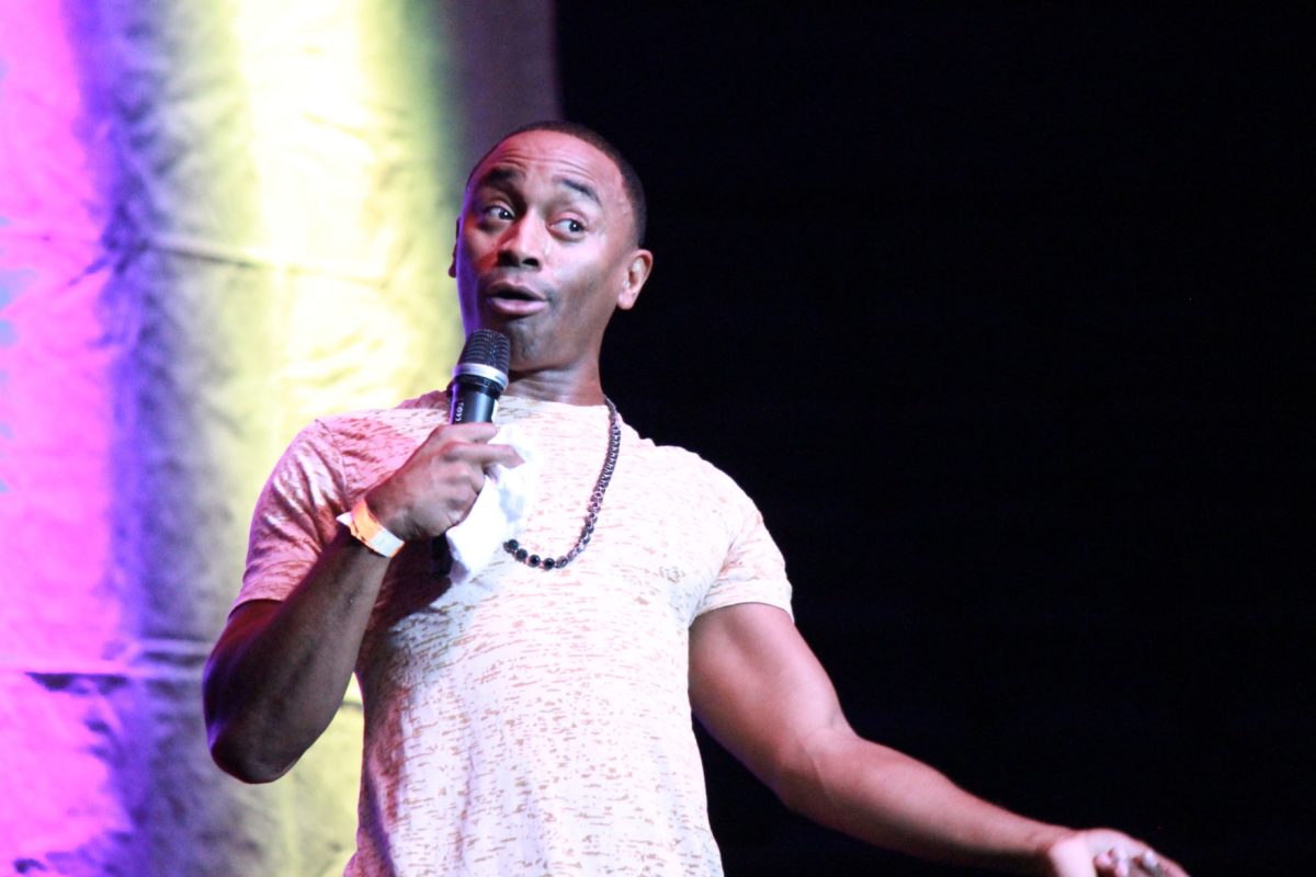 Comedy show host D'Lain performs his set at SU homecoming comedy show