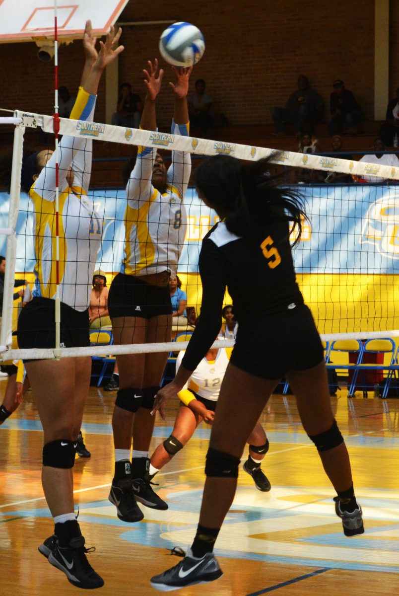 Sophmore middle blocker/ right side Paige Hall and returing juniormiddle blocker/ right side Bayley Neubauer block a spike against the Grambling State Tigers on October 28, in Seymour Gym.