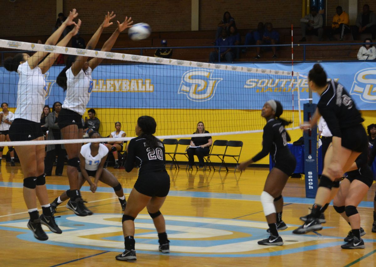 Sophmore middle blocker/ right side and returning Junior middle blocker/ right side Bayley Neubauer block a spike during the Texas Southern game on Friday, November 11, in Seymour Gym.