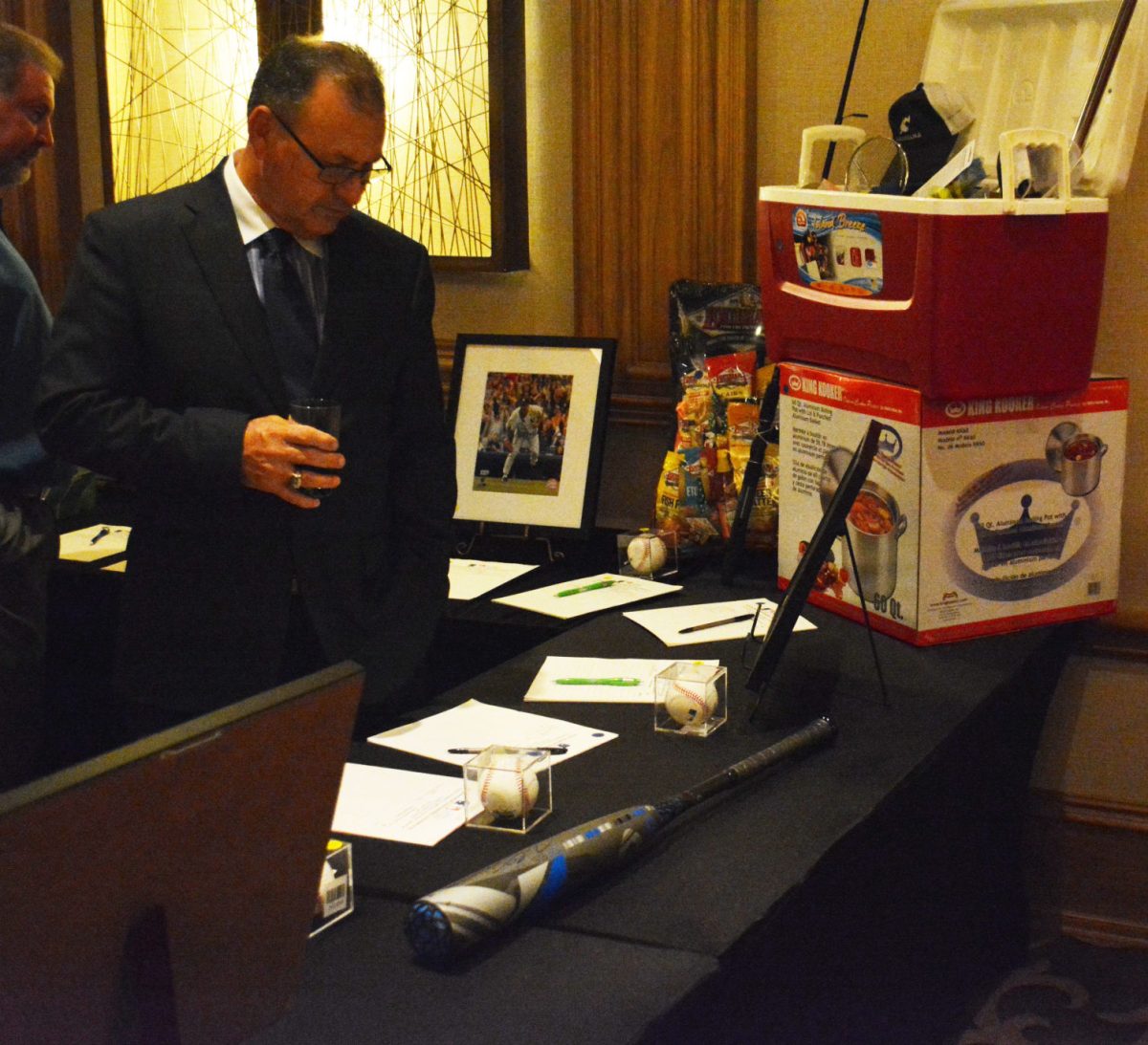 A potential buyer takes a look at one of the many items he could win during a silent auction at the Southern University Baseball Gala on Wednsday, November 9, at the L'Auberge Hotel.