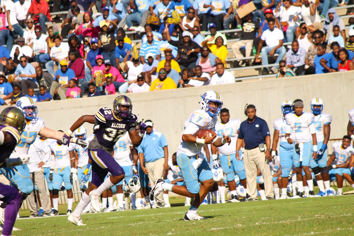 Senior quarterback, Austin Howard, evades a group of Alcorn defenders as he scrabbles to the first down marker on Saturday, October 29, at Jack Spinks Stadium. The Jaguars routed the Braves 41-33 in Lorman, MS. Howard finished with 2 passing touchdowns, 195 yards passing, and 31 rushing yards.