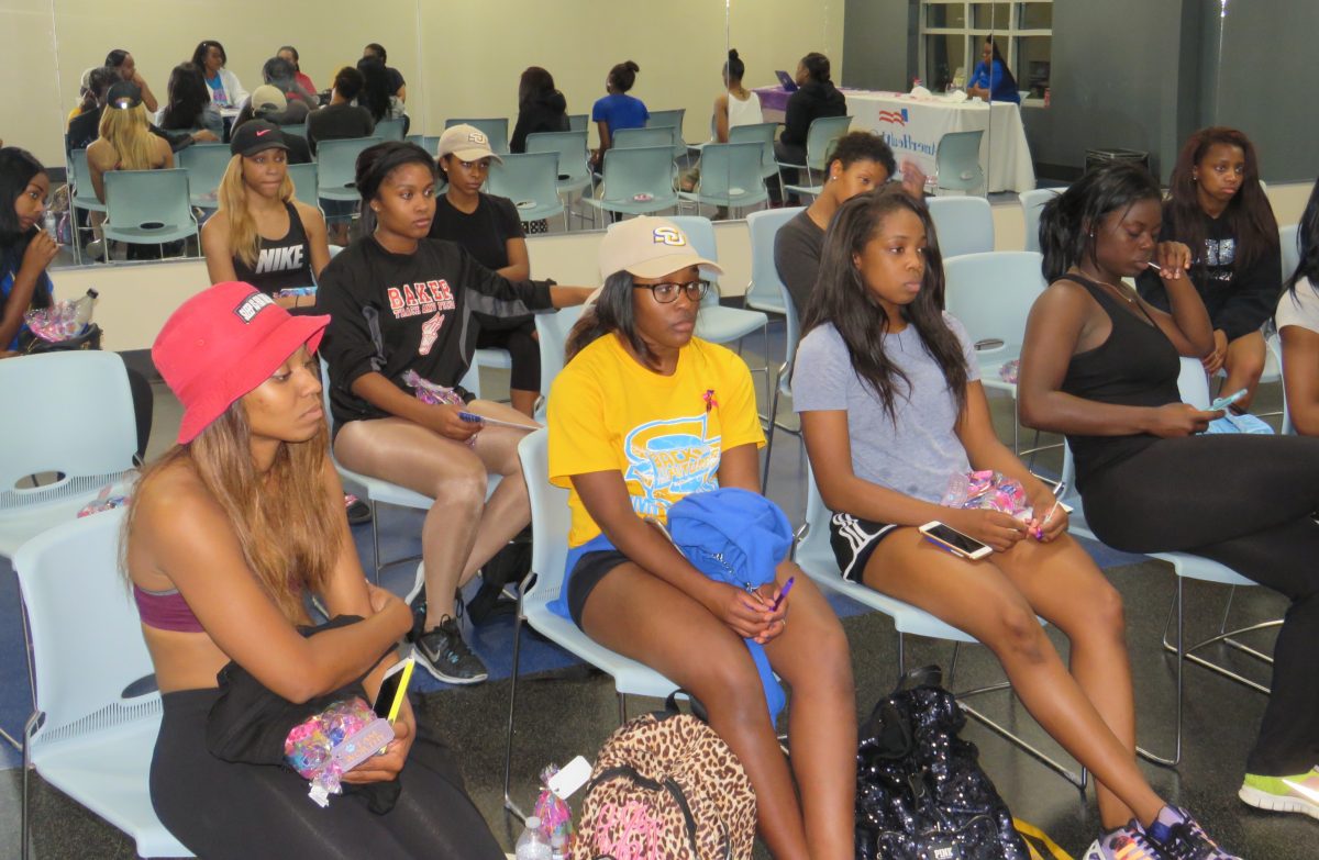 Students listen to the keynote speakers at&#160; the Women Health event held on Thursday, October 27, in the Intramural Complex hosted by AmerHealth, Woo Wear, and Sugafoot Pedicures and Manicures Spa.