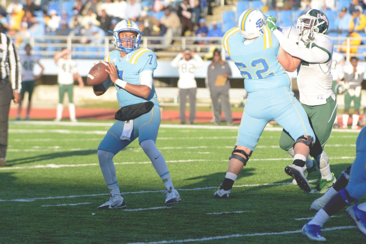 Junior quarter back Austin Howard prepares to throw the ball at final home game on Saturday 11/19