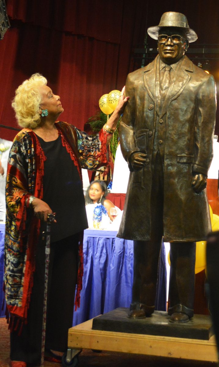 Irene Mumford stands next to the new A.W. Mumford statue during the Southern University Sports Hall of Fame Enshrinement Ceremony on Friday, November 4, at the Belle of Baton Rouge.