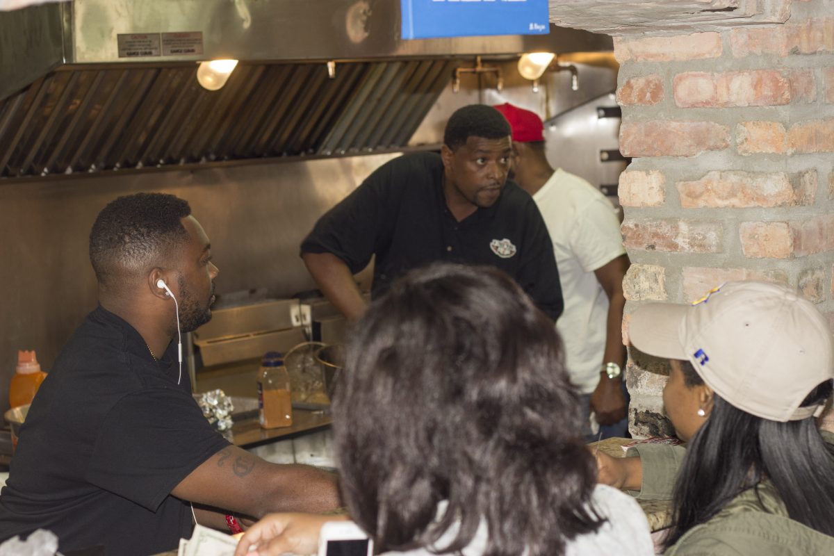 Co Owners Victor Smith and Derrick Revish hard work in their restaurant Empire Wingz. Empire Wingz is Scotlandvilles newwest restaurant opened just across The Hump.