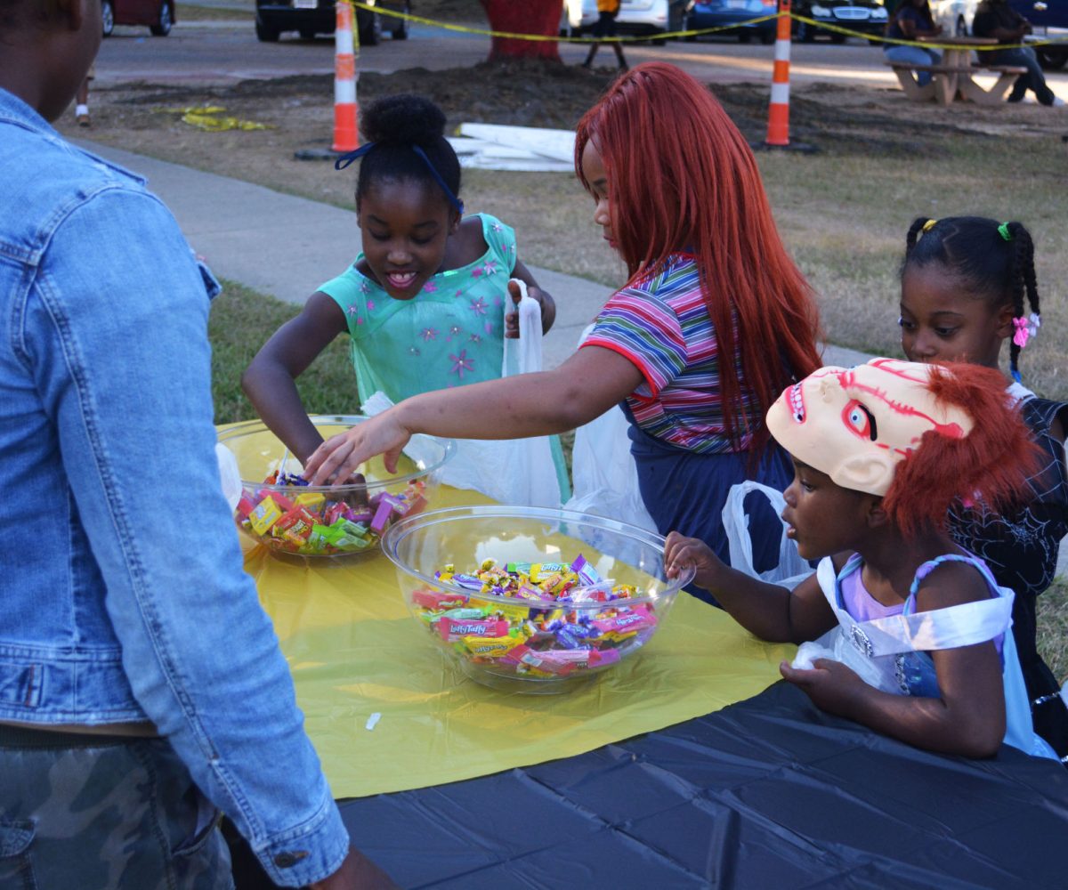 Childern getting the chance to grab some candy during Boo @SU on Sunday, October 30.