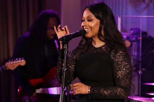 FILE - In this Aug. 2, 2016, file photo, singer Chrisette Michele performs for President Barack Obama, first lady Michelle Obama, Singapore's Prime Minister Lee Hsien Loong, and his wife Ho Ching, in the State Dining Room of the White House during a state dinner in Washington. The New York Daily News reported on Jan. 18, 2017, that Michele would perform at President-elect Donald Trump's inauguration Jan. 20, 2017. (AP Photo/Jacquelyn Martin, File)