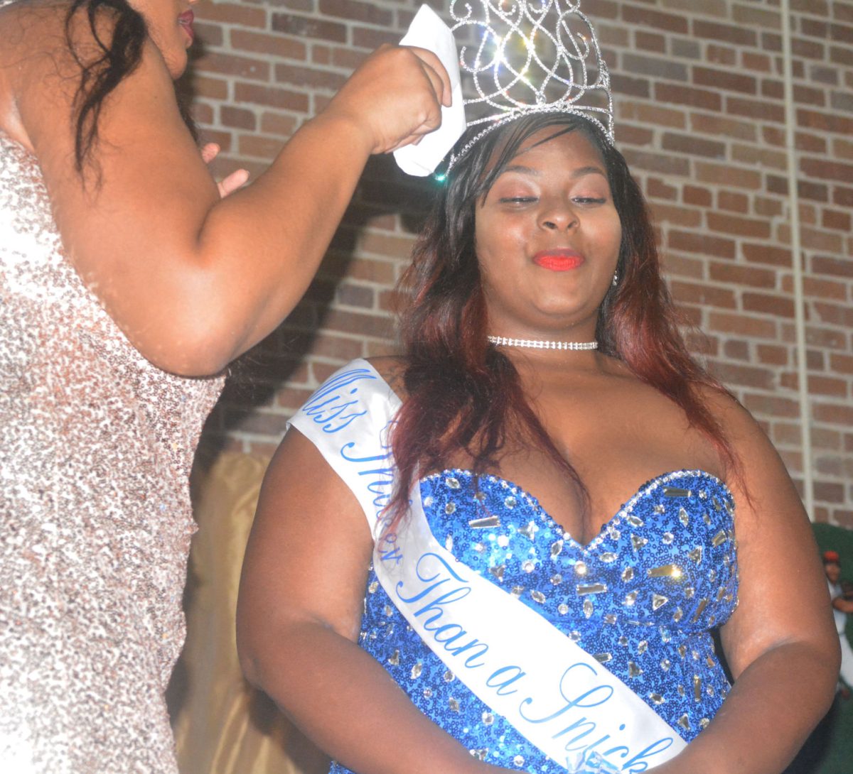 Majesti Smith,a junior from Goldsboro,NC., recieves her crown during the Miss Thicker Than a Snicker Pagent on Wednsday, Feburary 8th, in the Event Center.