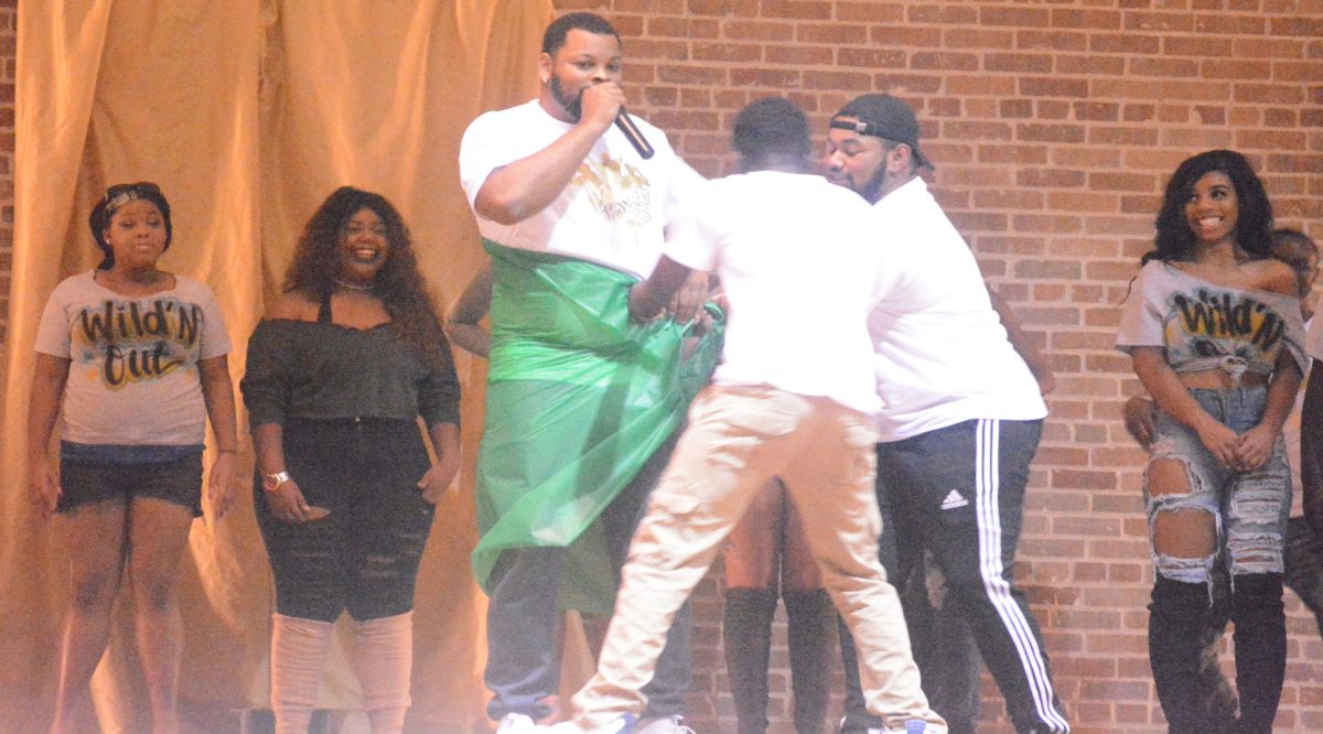 A member of the 24k MAgic squad gets wrapped around a prop during WildN'Out on Friday, Feburary 10, in the Event Center.