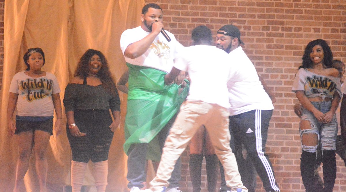 A member of the 24k MAgic squad gets wrapped around a prop during WildN'Out on Friday, Feburary 10, in the Event Center.