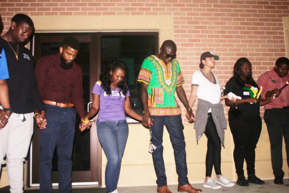 Students praying at LSU's prayer vigil for the passing of Dr.Troy Allen