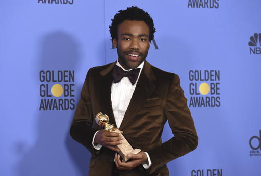 FILE - In this Jan. 8, 2017 file photoi, Donald Glover poses in the press room with the award for best performance by an actor in a television series - musical or comedy for 