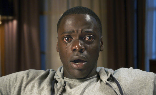 This image released by Universal Pictures shows Daniel Kaluuya in a scene from, "Get Out." Jordan Peele&#8217;s thriller sensation &#8220;Get Out&#8221; crossed $100 million over the weekend, reaching that milestone in just 16 days. It&#8217;s a staggering result for a film that, though it cost less than $5 million to make, has become a cultural sensation. (Universal Pictures via AP)