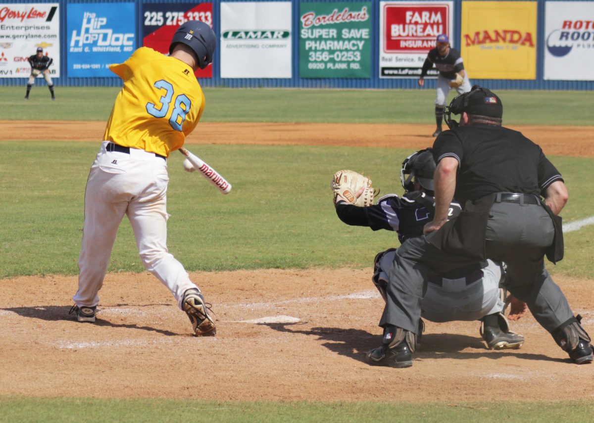 <p>SU Sophmore centerfielder Bobby Johnson makes contact with a fastball at Saturady's game at Lee Hines Stadium.</p>