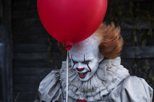 This image released by Warner Bros. Pictures shows Bill Skarsgard in a scene from "It." (Brooke Palmer/Warner Bros. Pictures via AP)