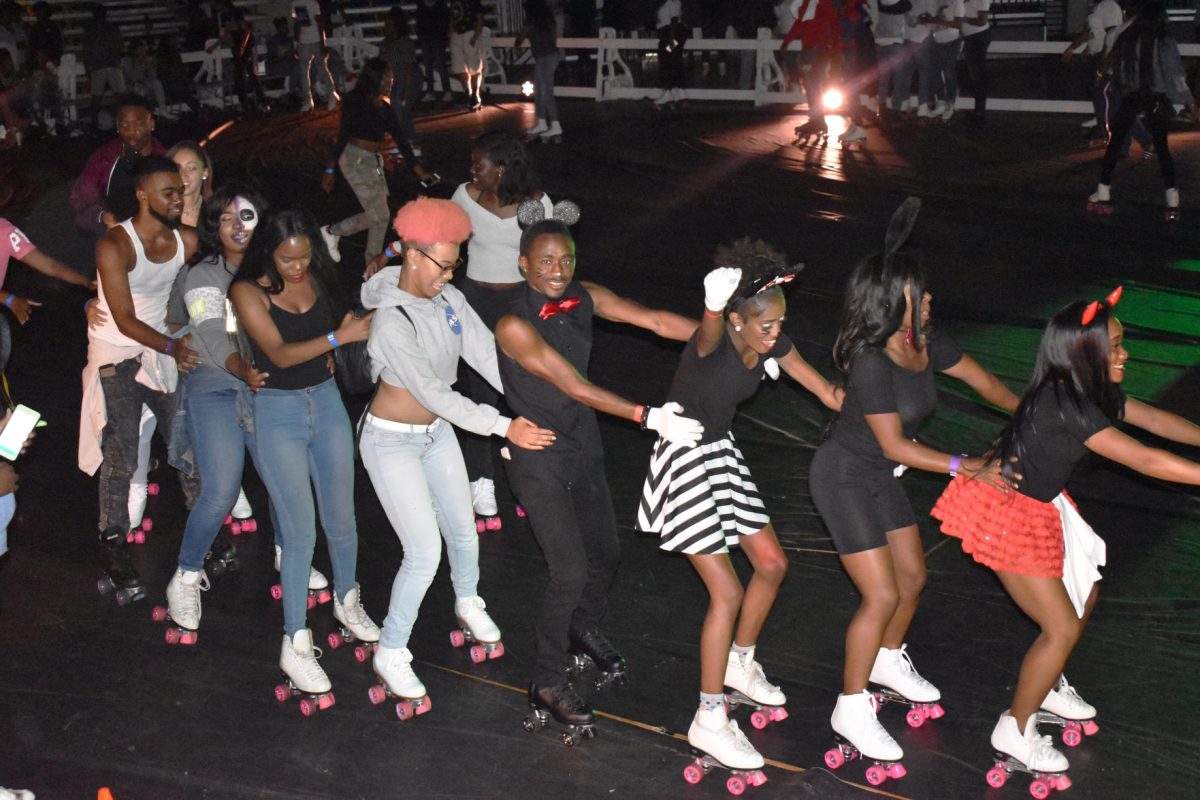 Students make a skate train at Jagscade on Thursday October 26, 2017 in the F.G Clark Activity center (Arnita Dove/DIGEST)