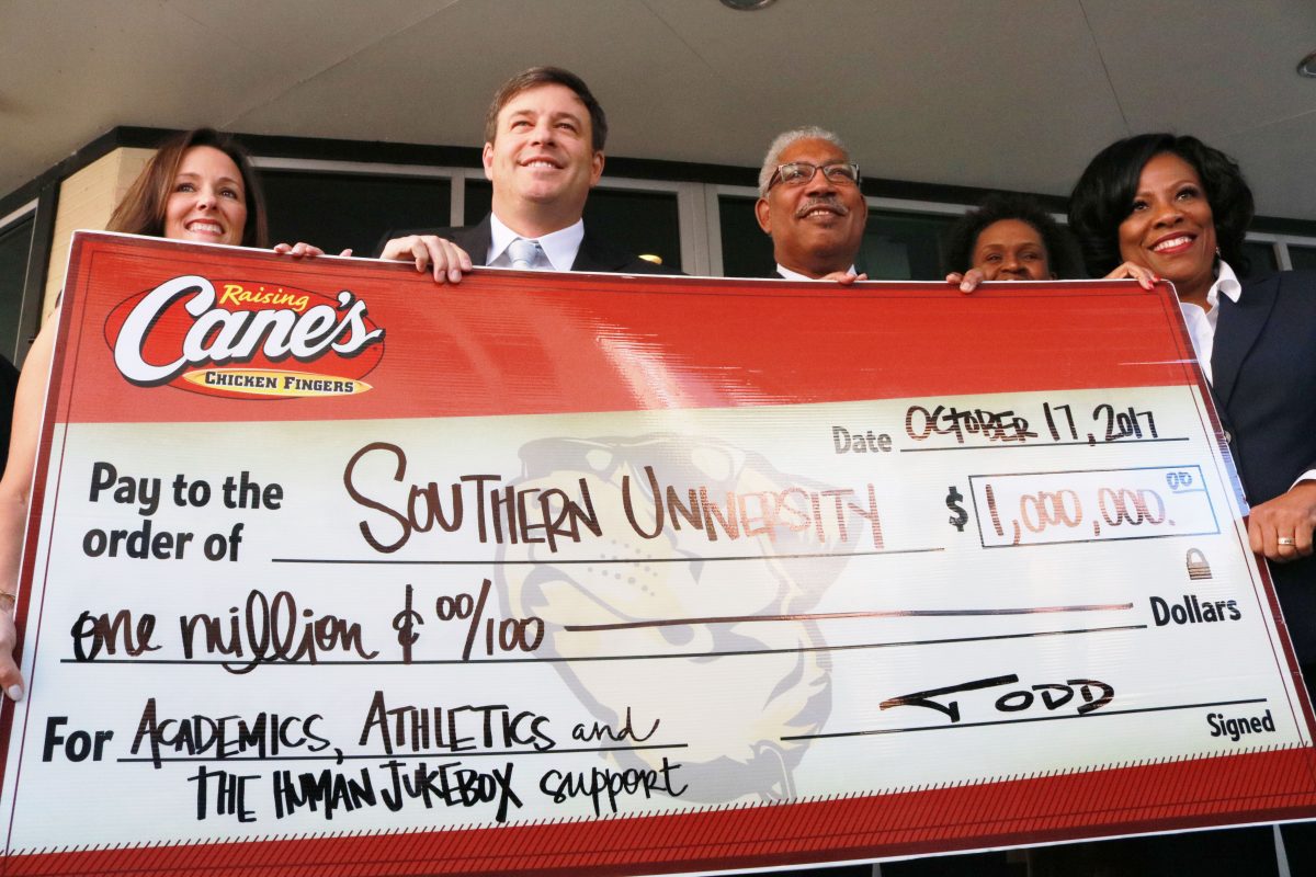 <p>Founder and CEO of Raising Cane’s, Todd Graves, President-Chancellor of Southern University, Dr. Ray Belton and Mayor-President of Baton Rouge, Sharon Weston-Broome celebrate the partnership of Cane’s and Southern University at a press conference on Thursday, October 17 in Downtown, Baton Rouge. (Kyndall Jones/DIGEST)</p>