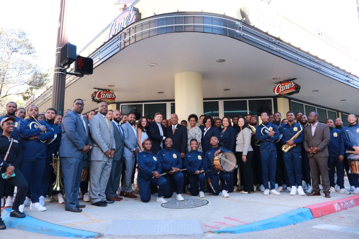 Founder and CEO of Raising Cane&#8217;s, Todd Graves, along with President-Chancellor, Dr. Ray Belton, The Human Jukebox and supporters from Southern University celebrate the announcement of the $1 million partnership in Downtown, Baton Rouge on Tuesday, October 17.