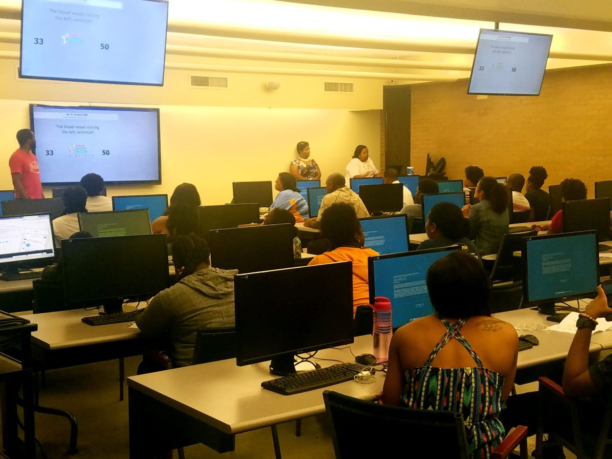 Deadra James Mackie (far top right) supervising a quiz bowl match in the computer lab of the PBS Pinchback Engineering Building October 11.
(James Eaglin, Jr./DIGEST)