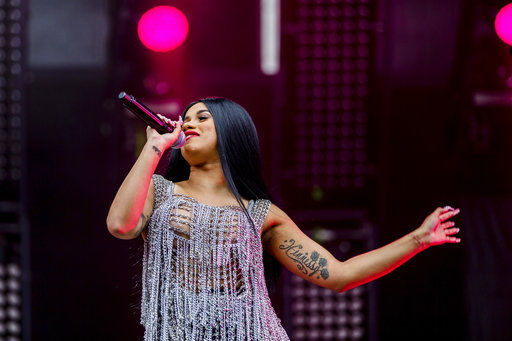 FILE - In this Saturday, Sept. 2, 2017, file photo, Cardi B performs at The Budweiser Made In America Festival in Philadelphia. Cardi B has a breakthrough hit with "Bodak Yellow (Money Moves)" and the rapper said she's ready to follow the single's success with an album next month. (Photo by Michael Zorn/Invision/AP, File)