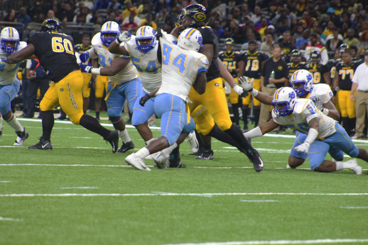 Senior Defensive Lineman Aaron Tiller fights off a Grambling State lineman in Saturday's 44th annual Bayou Classic. (Devin Hadrick/DIGEST)