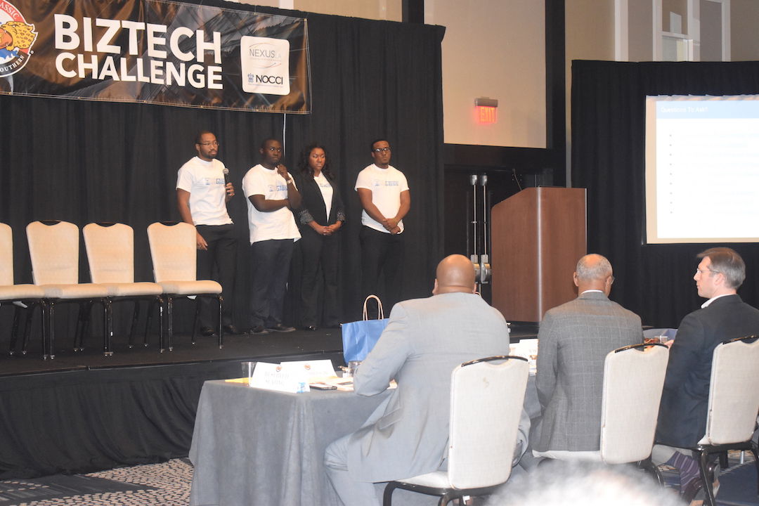 SUBR students, Nathan Morrison, Polite Stewart, Jr., Rashad Pierre, and Ashley Lewis present their business plan, Our Glass, during the Biztech Challenge on November 24. They placed 1st in the competition, walking away with a $10,000 check and an additional $10,000 in legal fees.