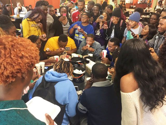 Students scarf down mystery cupcakes in final round of fear factor in mayberry dining hall on October 31 (Kerry Wilson/ DIGEST)