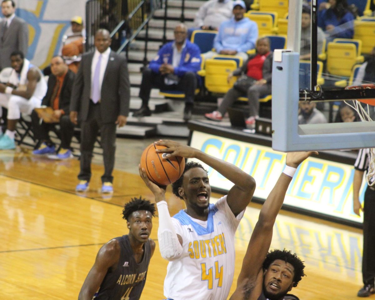 Returning Freshman Forward, Mubashar Ali goes in for a lay up against an Alcorn State defender on January 27, in the F.G. Clark Activity Center.