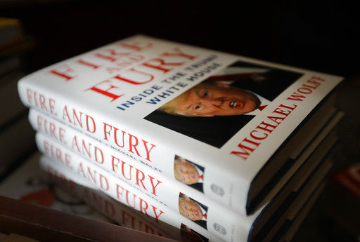 FILE - In this Jan. 5, 2018 file photo, copies of the book "Fire&#160;and&#160;Fury: Inside the Trump White House" by Michael Wolff are displayed at Barbara's Books Store in Chicago. Wolff's "Fire&#160;and&#160;Fury" is well on its way to becoming one of the top selling nonfiction books in recent years. The tell-all about the Trump administration book has sold more than 1.7 million copies in the combined formats of hardcover, e-books and audio, publisher Henry Holt and Company told The Associated Press on Wednesday, Jan. 24. Published less than 3 weeks ago, the book remains No. 1 on Amazon.com and other lists. (AP Photo/Charles Rex Arbogast, File)