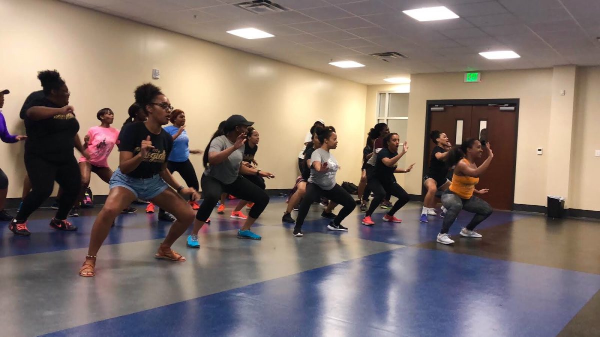 Students work up a sweat during &#8220;Zumba Night,&#8221; hosted by the Collegiate 100 Black Women of Southern University, held inside the Intramural Complex. (Devon Fedrick/DIGEST)