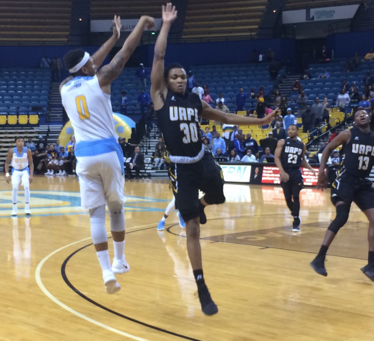 Senior Guard, Richard Lee shoots a three-pointer over a UAPB Freshman guard&#160; Cameron Posey on Saturday, February 10 in the F.G. Clark Activity Center.(Caleb Penn/DIGEST)