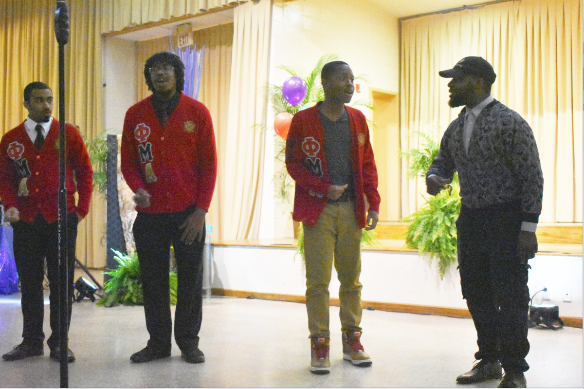 The men of Phi Mu Alpha Fraternity performing an acapella at the Black arts Showcase in the Smith-Brown Union Ballroom on February 15. (Shomari Moore/DIGEST)