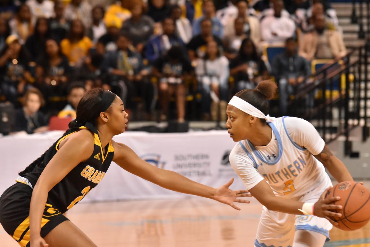 Senior guard Danayea Charles moves the ball up court to take home the win against Grambling Tigers on Feburary 9 in the F.G Clark Activity Center. (BAILIE BOYD/DIGEST)