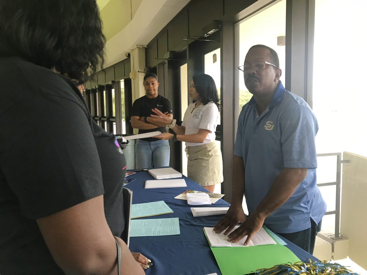 SU Honors program associate, Mr. Eric Pugh speaks to a perspective student during the 2019 Spring High School Preview Day inside F.G. Clark Activity on Saturday, February 23. (DIGEST FILE)