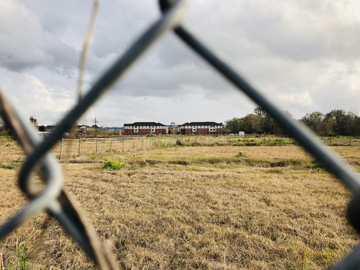 Southern University apartments sit behind these gates near the plant. (Khidhr Al-Mustafa/DIGEST)